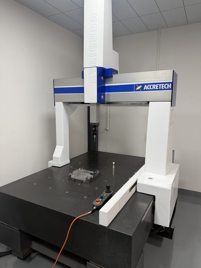 Coordinate measuring machine (CMM) inspecting a mold base in Hsingchao Mould's inspection room