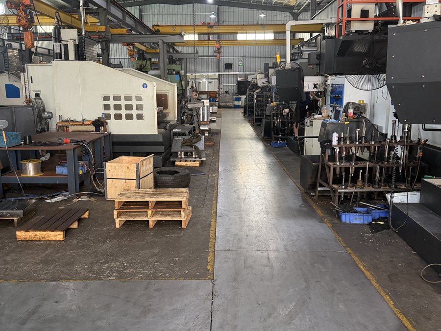 Crated mold bases staged on the workshop floor awaiting collection